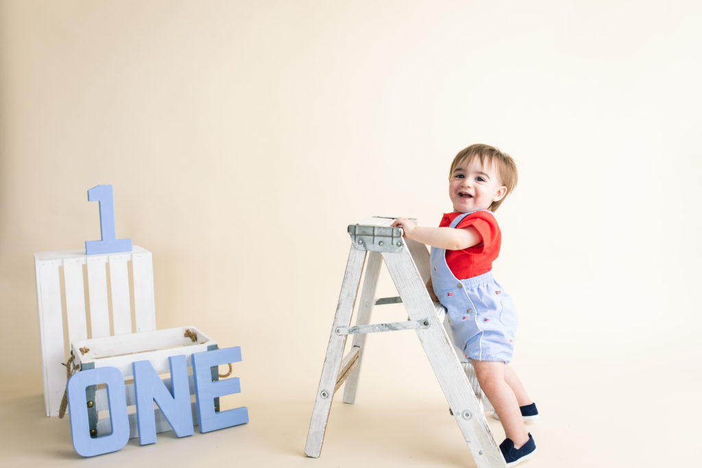 One year old with ladder