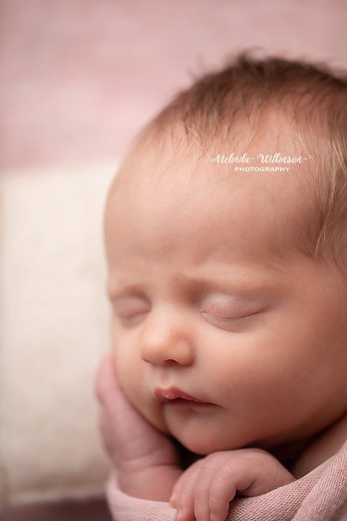 Newborn girl sleeping face