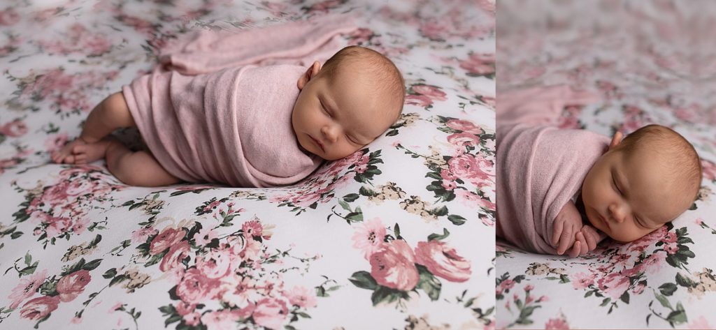 Newborn wrapped in pink on floral blanket